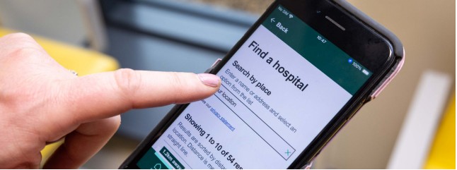 Picture of phone with HSE.ie hospital service finder on screen